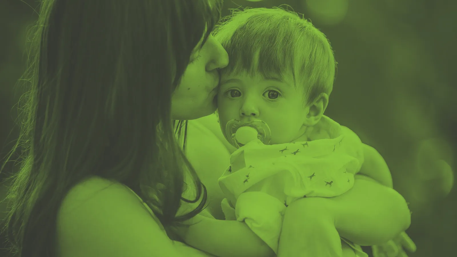 Image of a woman kissing a small child - Cosaraf Charitable Foundation’s Hardship Grants for those who have exhausted all other sources of funding