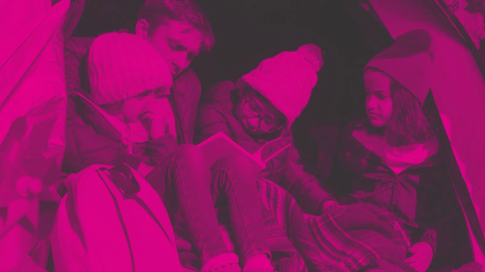 An image of a family group in a tent - apply for grants to support recreational trips or holidays within the UK for groups of disabled or disadvantaged children (aged 13 or under)